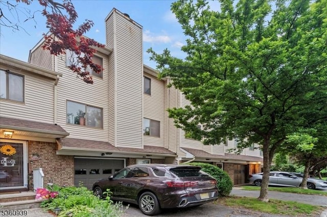 804 Orchard Meadows Dr, Union Twp, NJ 07083 - townhome / multi-family property featuring a garage, a chimney, and brick siding
