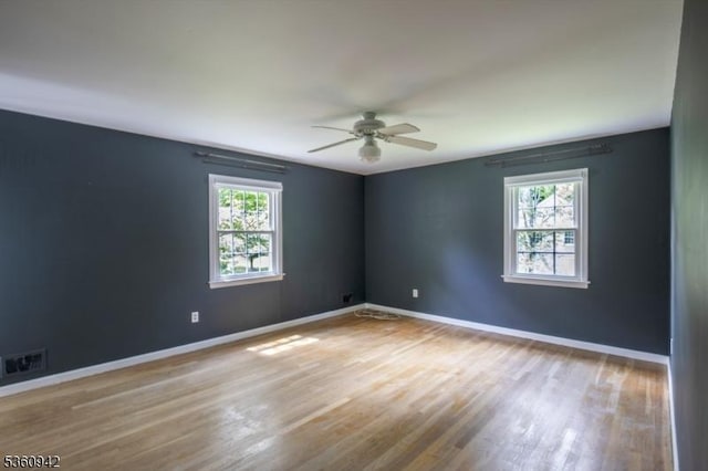 3 Rolling Hill Dr, Morris Twp, NJ 07960 - unfurnished room featuring plenty of natural light, a ceiling fan, wood finished floors, and baseboards