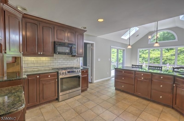 3 Rolling Hill Dr, Morris Twp, NJ 07960 - kitchen with black microwave, stainless steel range with gas cooktop, a skylight, backsplash, and vaulted ceiling