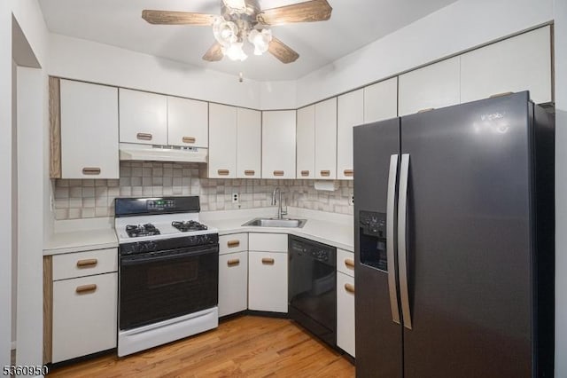 31 Canterberry Cir, Raritan Twp, NJ 08822 - kitchen with stainless steel fridge, white range with gas cooktop, dishwasher, a sink, and under cabinet range hood