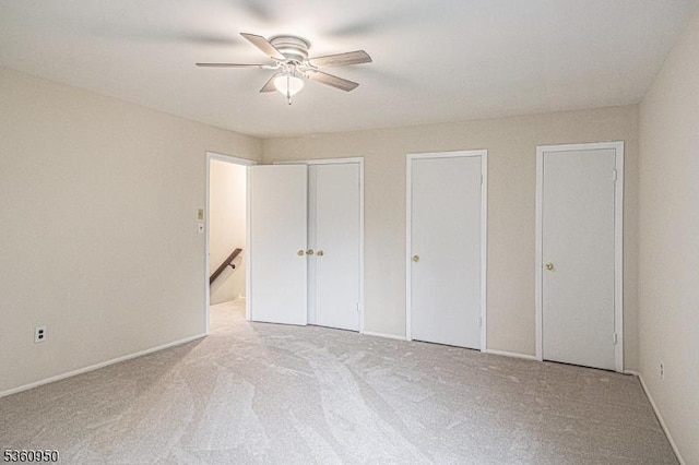 31 Canterberry Cir, Raritan Twp, NJ 08822 - unfurnished bedroom with two closets, carpet flooring, ceiling fan, and baseboards