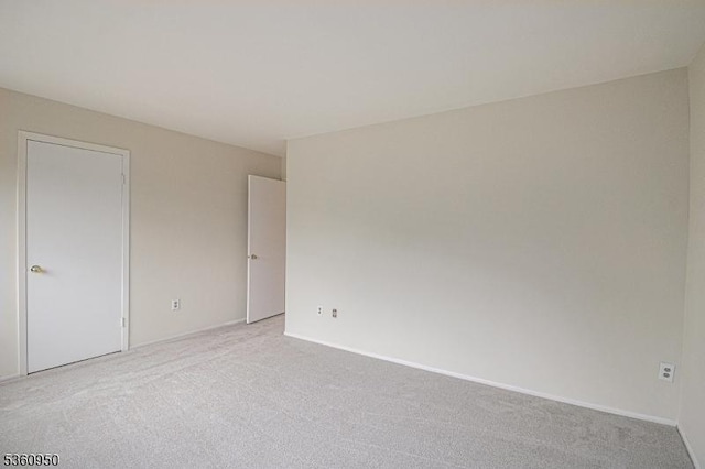 31 Canterberry Cir, Raritan Twp, NJ 08822 - empty room with light carpet and baseboards