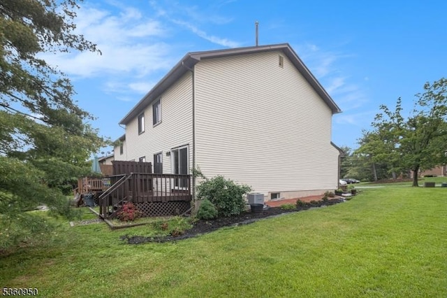 31 Canterberry Cir, Raritan Twp, NJ 08822 - view of side of property featuring a deck, a lawn, and cooling unit