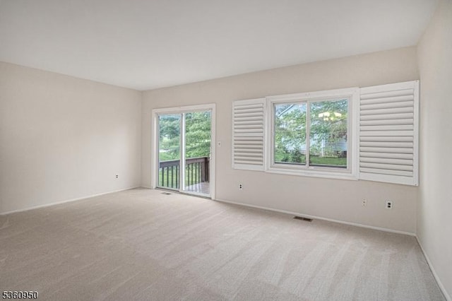 31 Canterberry Cir, Raritan Twp, NJ 08822 - spare room featuring light carpet and baseboards