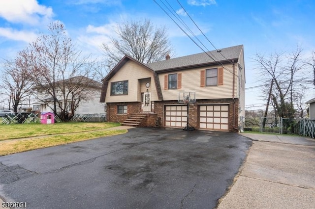 55 Jefferson St, Clifton City, NJ 07014 - split foyer home with asphalt driveway, an attached garage, and brick siding