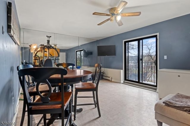 55 Jefferson St, Clifton City, NJ 07014 - dining area featuring a baseboard heating unit, a ceiling fan, and a chandelier