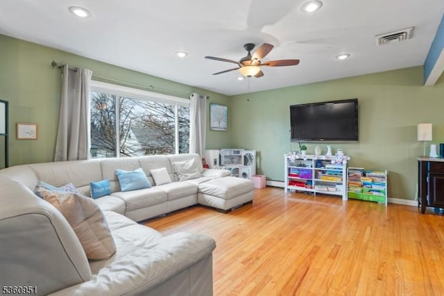 55 Jefferson St, Clifton City, NJ 07014 - living room featuring a ceiling fan, recessed lighting, wood finished floors, a baseboard heating unit, and baseboards