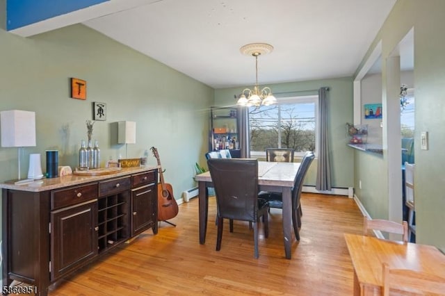 55 Jefferson St, Clifton City, NJ 07014 - dining room featuring a chandelier, light wood-style flooring, a baseboard heating unit, and baseboards