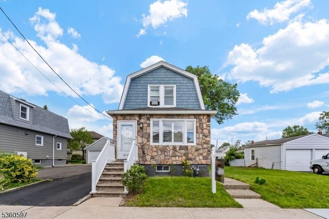 24-09 Raphael St, Fair Lawn Boro, NJ 07410 - dutch colonial with a garage, stone siding, a gambrel roof, a front yard, and a residential view