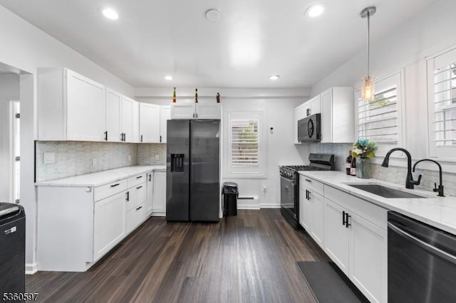 24-09 Raphael St, Fair Lawn Boro, NJ 07410 - kitchen with stainless steel appliances, a sink, recessed lighting, white cabinets, and dark wood-style flooring