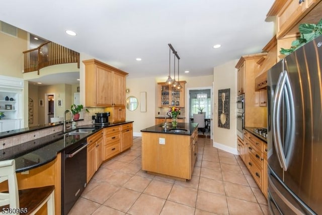 7 Briscoe Chase, Ringwood Boro, NJ 07456 - kitchen featuring stainless steel appliances, a sink, a center island, decorative backsplash, and light tile patterned floors