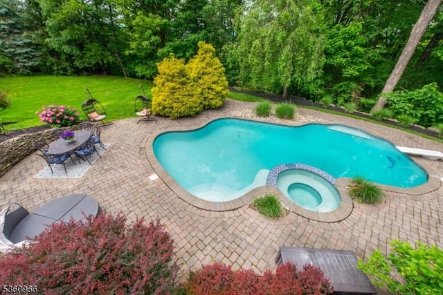 7 Briscoe Chase, Ringwood Boro, NJ 07456 - view of swimming pool with a patio, a lawn, a diving board, and a pool with connected hot tub