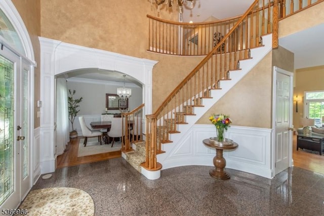 7 Briscoe Chase, Ringwood Boro, NJ 07456 - entryway with granite floors, a decorative wall, a towering ceiling, a chandelier, and stairway