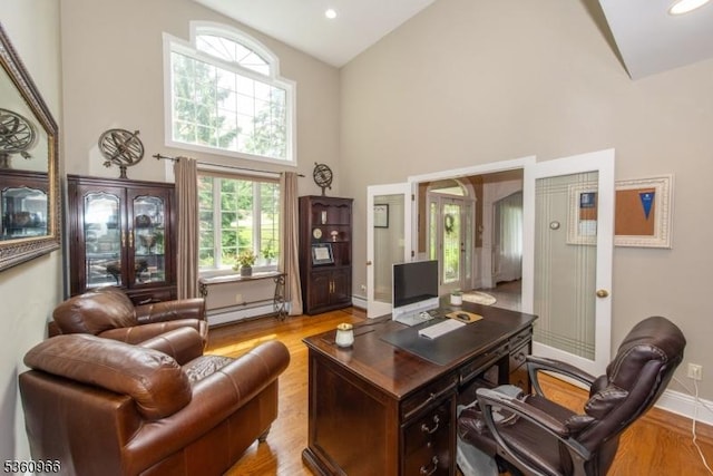 7 Briscoe Chase, Ringwood Boro, NJ 07456 - home office with a baseboard radiator, high vaulted ceiling, light wood-type flooring, baseboards, and recessed lighting