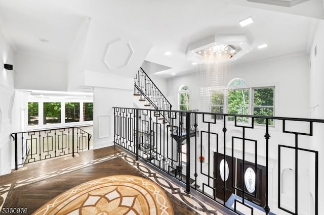 47 Cutlass Rd, Kinnelon Boro, NJ 07405 - stairs with a chandelier, wood finished floors, and crown molding