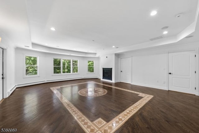 47 Cutlass Rd, Kinnelon Boro, NJ 07405 - unfurnished living room with a tray ceiling, a glass covered fireplace, recessed lighting, wood finished floors, and plenty of natural light