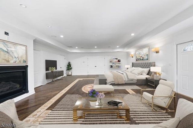47 Cutlass Rd, Kinnelon Boro, NJ 07405 - living room with recessed lighting, a raised ceiling, a glass covered fireplace, and wood finished floors