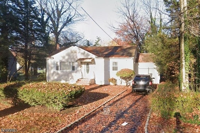 433 Grant Ave, Scotch Plains Twp, NJ 07076 - view of front of property with entry steps, a chimney, and dirt driveway