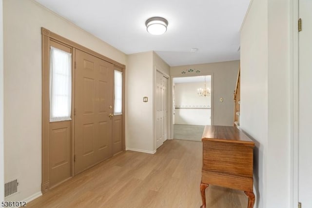25 Shannon Rd, Bridgewater Twp, NJ 08807 - foyer featuring light wood-type flooring, a chandelier, and baseboards