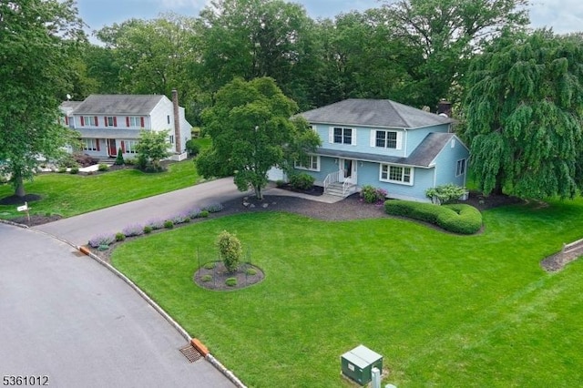 25 Shannon Rd, Bridgewater Twp, NJ 08807 - view of front of home featuring driveway and a front lawn