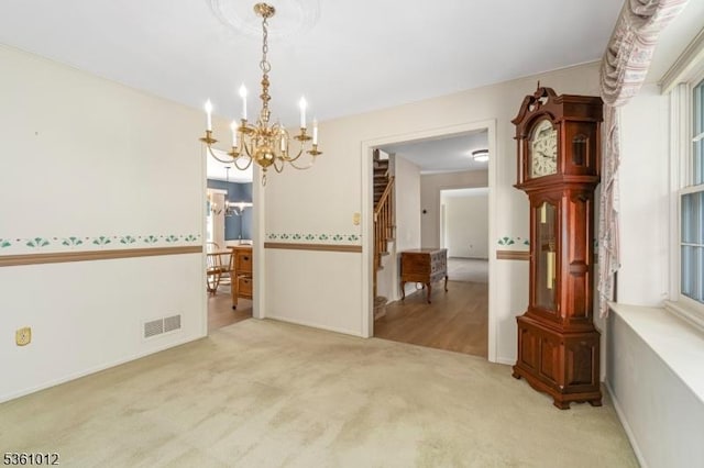 25 Shannon Rd, Bridgewater Twp, NJ 08807 - carpeted empty room featuring a chandelier and stairway