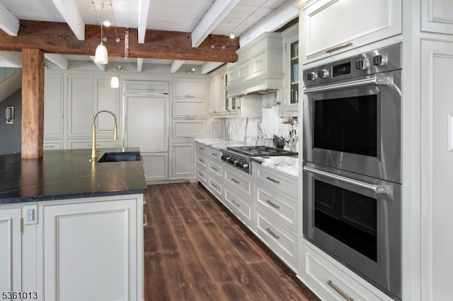 563 Cherry Valley Rd, Montgomery Twp, NJ 08540 - kitchen featuring stainless steel appliances, beam ceiling, dark wood-style floors, dark stone countertops, and glass insert cabinets