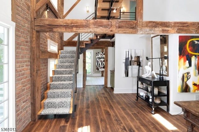 563 Cherry Valley Rd, Montgomery Twp, NJ 08540 - foyer entrance featuring wood finished floors, stairs, a high ceiling, and brick wall