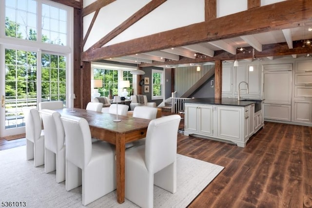 563 Cherry Valley Rd, Montgomery Twp, NJ 08540 - dining space with beam ceiling, wood finished floors, a towering ceiling, and stairway