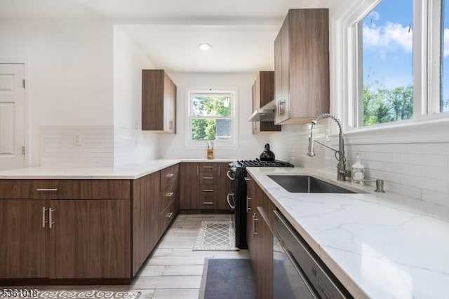 1038 Sherman Ave, Plainfield City, NJ 07063 - kitchen with a sink, decorative backsplash, gas range, light stone counters, and stainless steel dishwasher