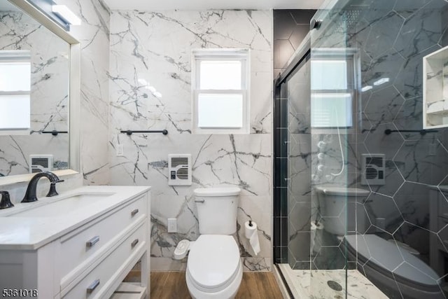 1038 Sherman Ave, Plainfield City, NJ 07063 - bathroom featuring tile walls, toilet, vanity, and a marble finish shower