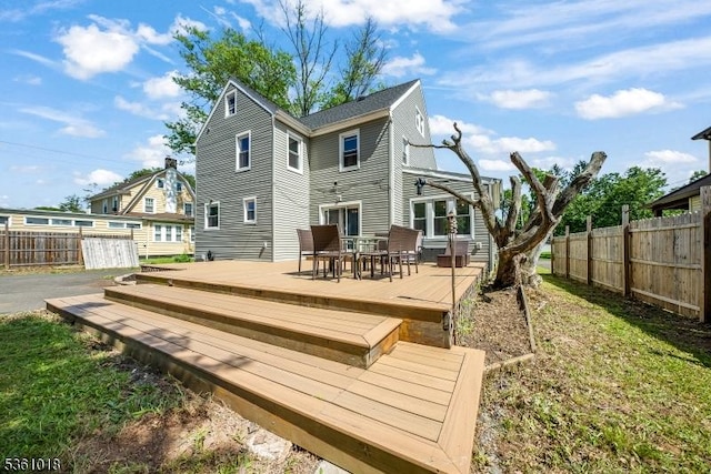 1038 Sherman Ave, Plainfield City, NJ 07063 - rear view of property featuring a wooden deck and outdoor dining area