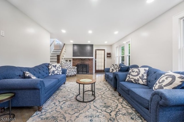 1038 Sherman Ave, Plainfield City, NJ 07063 - living area with wood finished floors, recessed lighting, and a brick fireplace