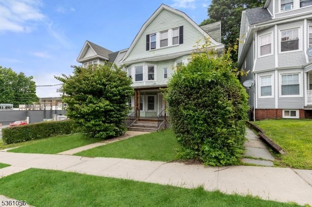 489 Conover Ter, City Of Orange Twp, NJ 07050 - view of front facade with a front yard and a porch