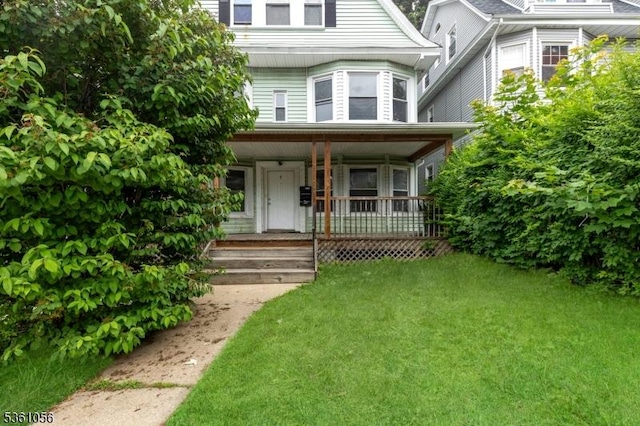 489 Conover Ter, City Of Orange Twp, NJ 07050 - view of front of house with a porch and a front lawn