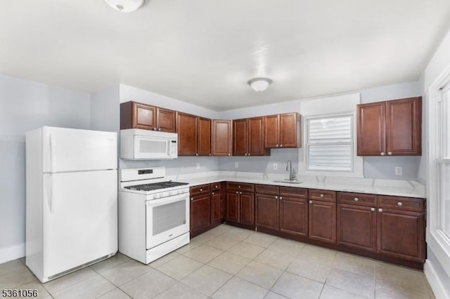 489 Conover Ter, City Of Orange Twp, NJ 07050 - kitchen featuring white appliances, a sink, light countertops, and light tile patterned floors