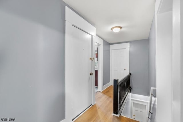489 Conover Ter, City Of Orange Twp, NJ 07050 - corridor featuring an upstairs landing, light wood finished floors, and baseboards