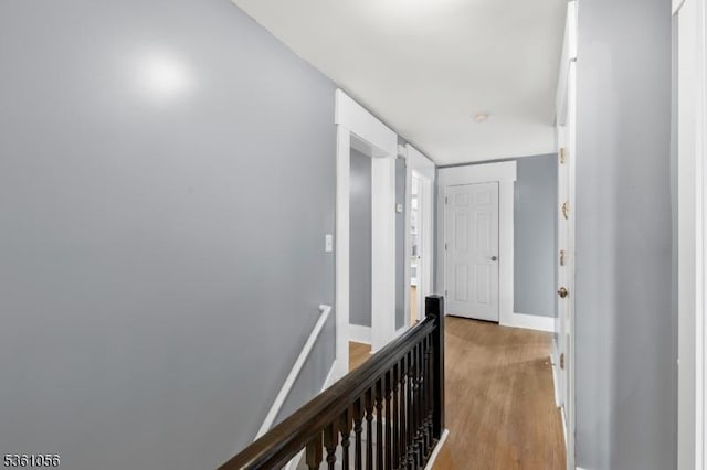 489 Conover Ter, City Of Orange Twp, NJ 07050 - corridor featuring an upstairs landing, light wood-style flooring, and baseboards