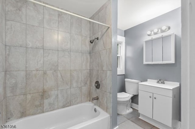489 Conover Ter, City Of Orange Twp, NJ 07050 - full bathroom featuring toilet, vanity,  shower combination, tile patterned floors, and baseboards