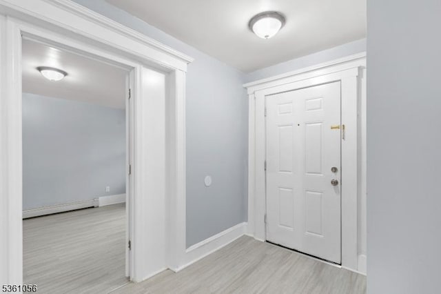 489 Conover Ter, City Of Orange Twp, NJ 07050 - foyer featuring baseboard heating, light wood-type flooring, and baseboards