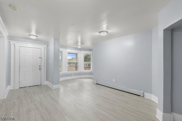 489 Conover Ter, City Of Orange Twp, NJ 07050 - entryway featuring a baseboard heating unit, wood finished floors, and baseboards