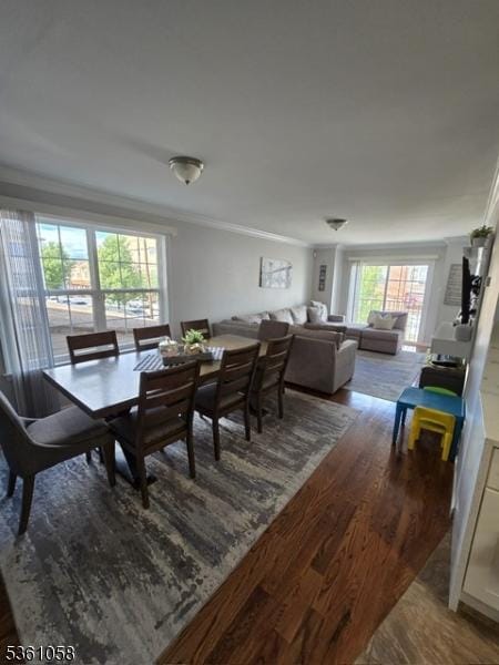 648 Marshall St, Elizabeth City, NJ 07206 - dining area with dark wood-style flooring and ornamental molding