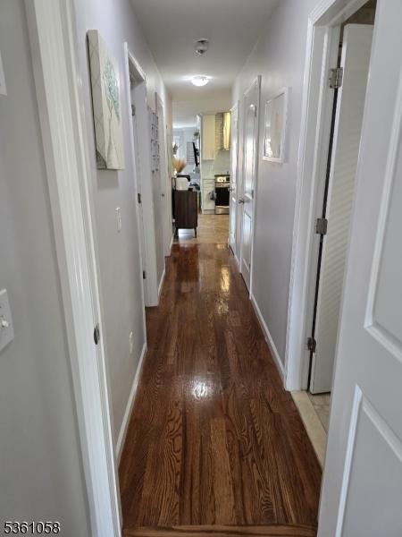 648 Marshall St, Elizabeth City, NJ 07206 - corridor with wood finished floors and baseboards