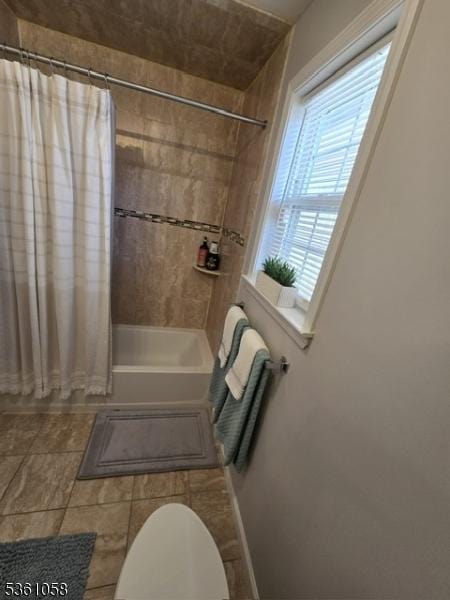 648 Marshall St, Elizabeth City, NJ 07206 - bathroom with shower / bath combo, toilet, and tile patterned floors