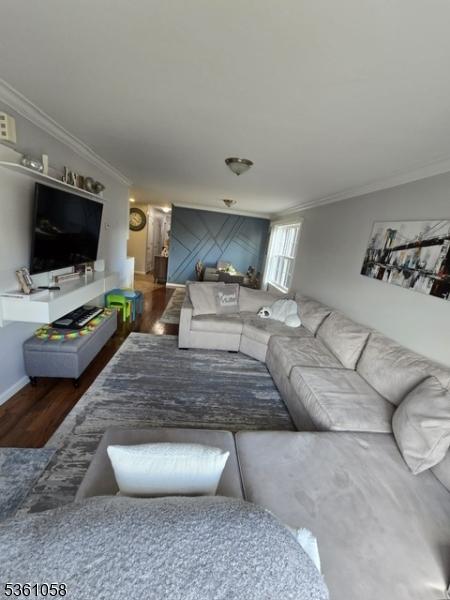648 Marshall St, Elizabeth City, NJ 07206 - living area featuring crown molding and wood finished floors