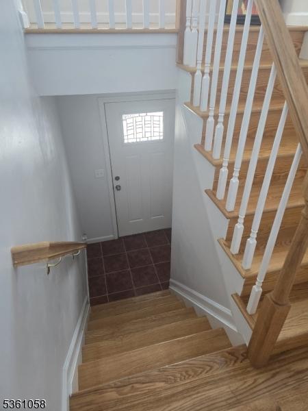 648 Marshall St, Elizabeth City, NJ 07206 - staircase featuring tile patterned flooring