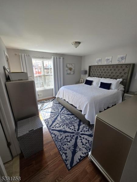 648 Marshall St, Elizabeth City, NJ 07206 - bedroom featuring wood finished floors