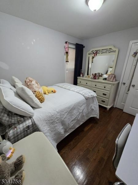648 Marshall St, Elizabeth City, NJ 07206 - bedroom featuring dark wood finished floors and an office area
