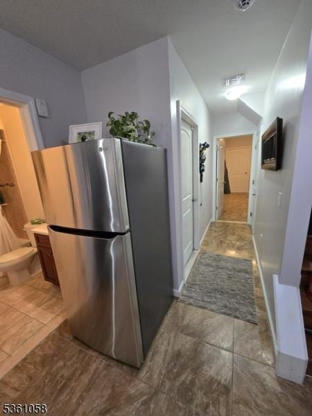 648 Marshall St, Elizabeth City, NJ 07206 - kitchen with freestanding refrigerator and tile patterned floors
