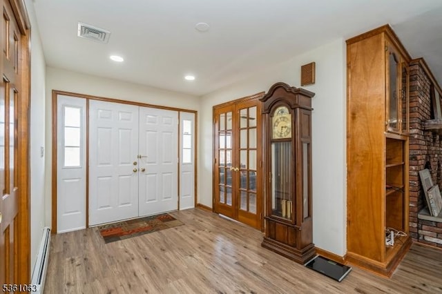 30 Claridge Ln, Raritan Twp, NJ 08822 - foyer entrance featuring french doors, a baseboard heating unit, wood finished floors, baseboards, and recessed lighting