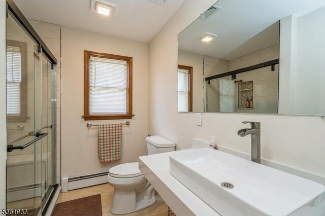 30 Claridge Ln, Raritan Twp, NJ 08822 - full bathroom featuring toilet, a baseboard heating unit, and a shower stall